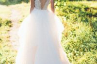 12 wedding ballgown with an illusion lace applique bodice, a V cut back and a layered skirt