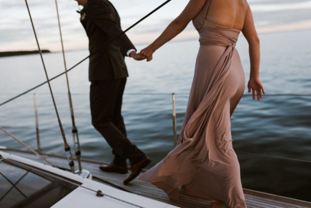 Have fun on a sailboat together like this couple