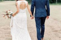 14 a boho lace sleeveless wedding dress with a keyhole back looks very chic and feminine