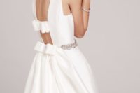 16 a gorgeous plain wedding dress with an embellished belt, a cutout back and bow detailing