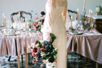 16 an embellished wedding dress with illusion sleeves and a modest neckline