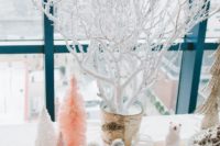 18 a snowy dessert bar with iced branches, pastel Christmas trees and snowflakes
