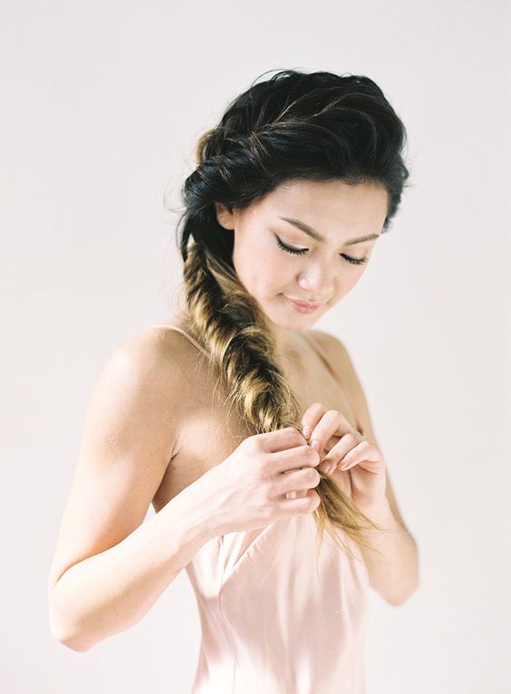 a voluminous side fishtail braid is easy to recreate yourself