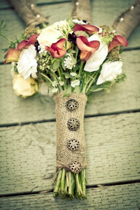 burlap wrap with vintage buttons looks rustic and very chic and will match many flowers
