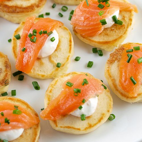 cream cheese pancakes with smoked salmon and greenery are a fresh take on salmon bites