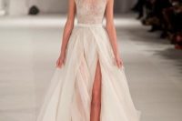 22 a chic cap sleeve embroidered sparkling bodice wedding dress with a layered skirt and a front slit