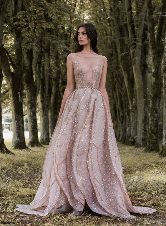 a pink cap sleeve wedding dress with an illusion neckline, embroidery and sparkling rhinestones