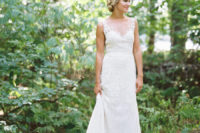 24 a sleeveless illusion neckline wedding dress with lace appliques, a lace skirt and a train