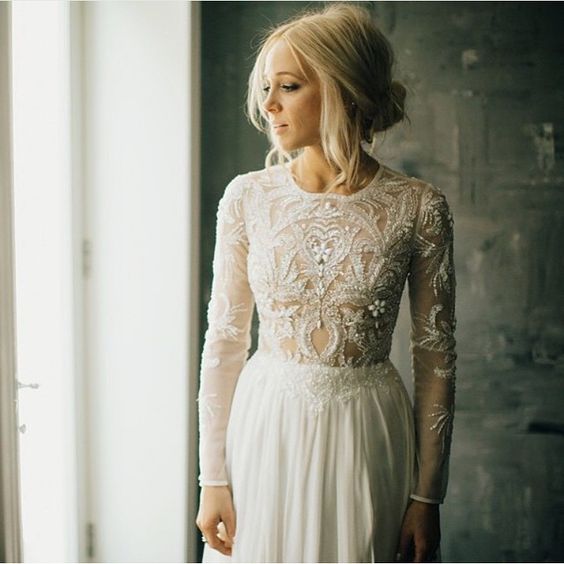 an illusion embroidered and embellished bodice and sleeves looks refined and sexy