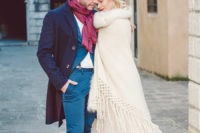 25 the groom wearing a bold blue suit, a navy coat, burgundy moccasins and a burgundy scarf
