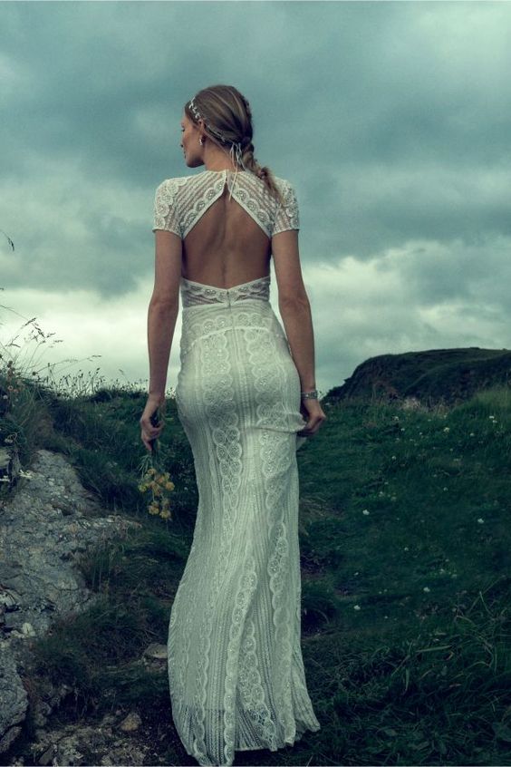 a sheath boho lace wedding dress with short sleeves, and a cutout back looks really wow
