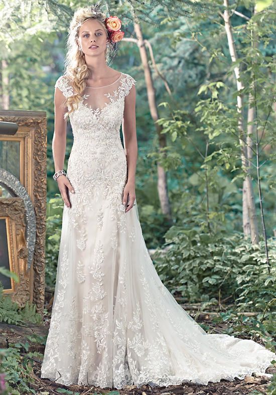 A-line slip dress with stunning illusion back and sweetheart neckline, edged in floral lace appliques