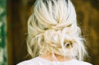 27 a very messy low updo with twists and bangs for an effortlessly chic look