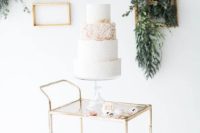 28 accentuate your wedding cake table with vintage frames and greenery and flowers attached to them