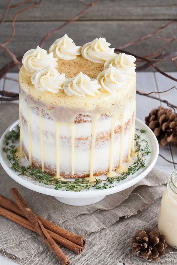 rum spiked eggnog cake with cream cheese frosting and white chocolate ganache