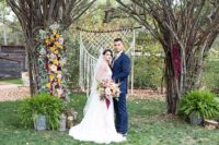 02 The trees were decorated with blooms and there was an embroidery hoop macrame decoration for the ceremony space