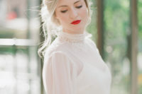 03 The bride was wearing a high neck lace wedding dress with a nod to the Edwardian era
