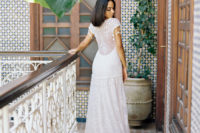 03 The second wedding dress was an illusion back lace gown with fringed cap sleeves