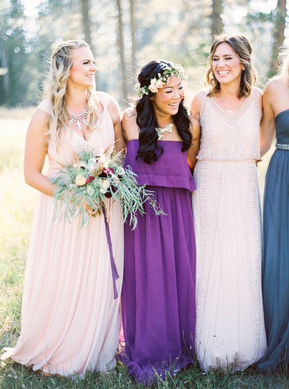 mismatching bridesmaids' dresses and a strapless boho gown for one of them is a great idea