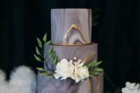05 a grey marbleized wedding cake with gold leaf and white blooms for detailing
