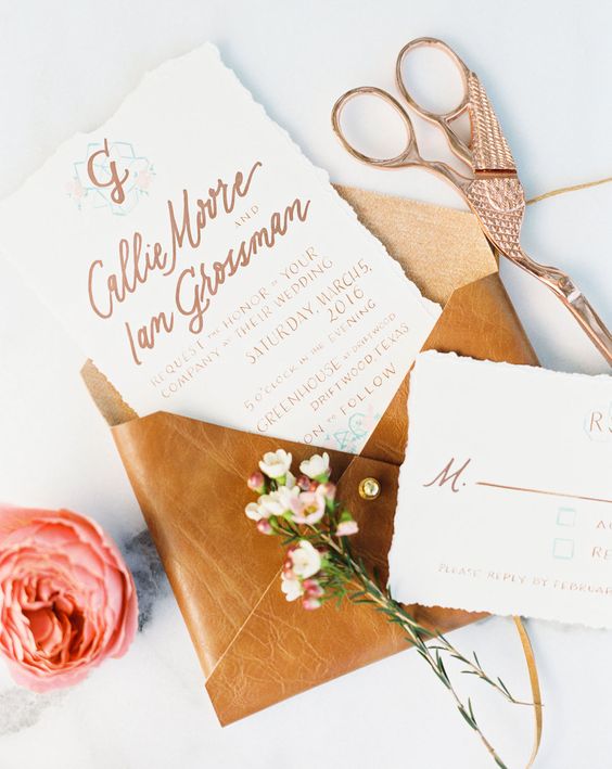 a leather and rhinestone envelope for cool wedding invtiations