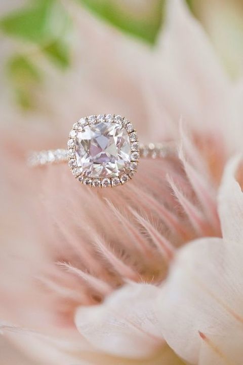 a rose gold engagement ring with a cushion pink diamond and a halo for a romantic girl