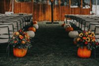 06 The wedding aisle was lined up with large pumpkins in orange and white
