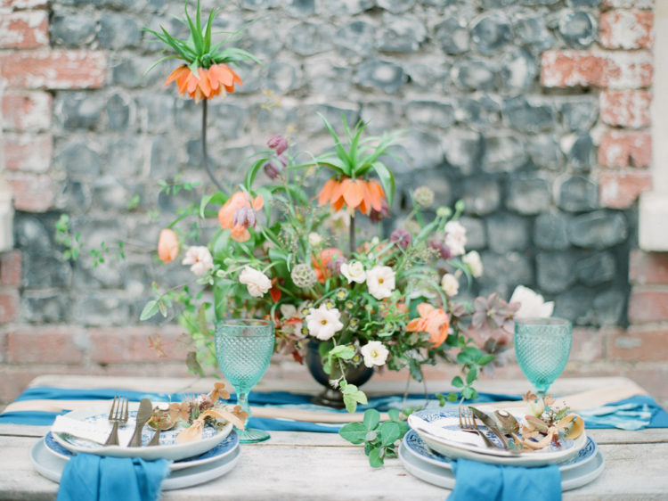 The wedding tablescape was done with a shibori table runner, blue crockery and bold statement blooms