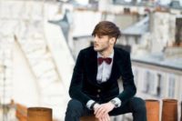 06 a black velvet jacket, black jeans, a burgundy velvet bow tie and brown boots for an edgy look