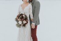 06 a boho lace long sleeve wedding dress with a deep V-neckline looks chic and refined