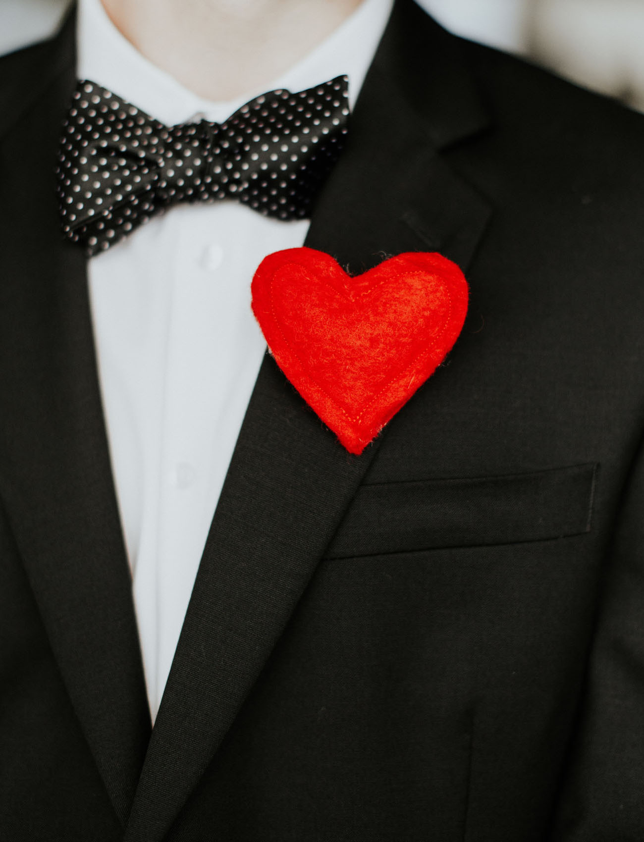 Boutonnieres were substituted with red hearts for the groom and groomsmen