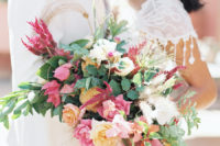 07 The bridal bouquet was a textural and lush one, with cascading greenery and bold blooms