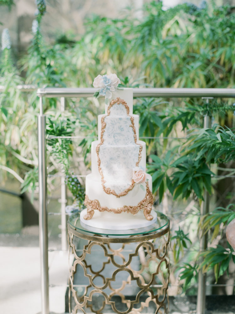 The first wedding cake was a watercolor botanical one with gold detailing and blooms