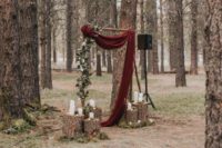 07 The groom made the altar by himself, with a fresh greenery garland and draped burgundy fabric