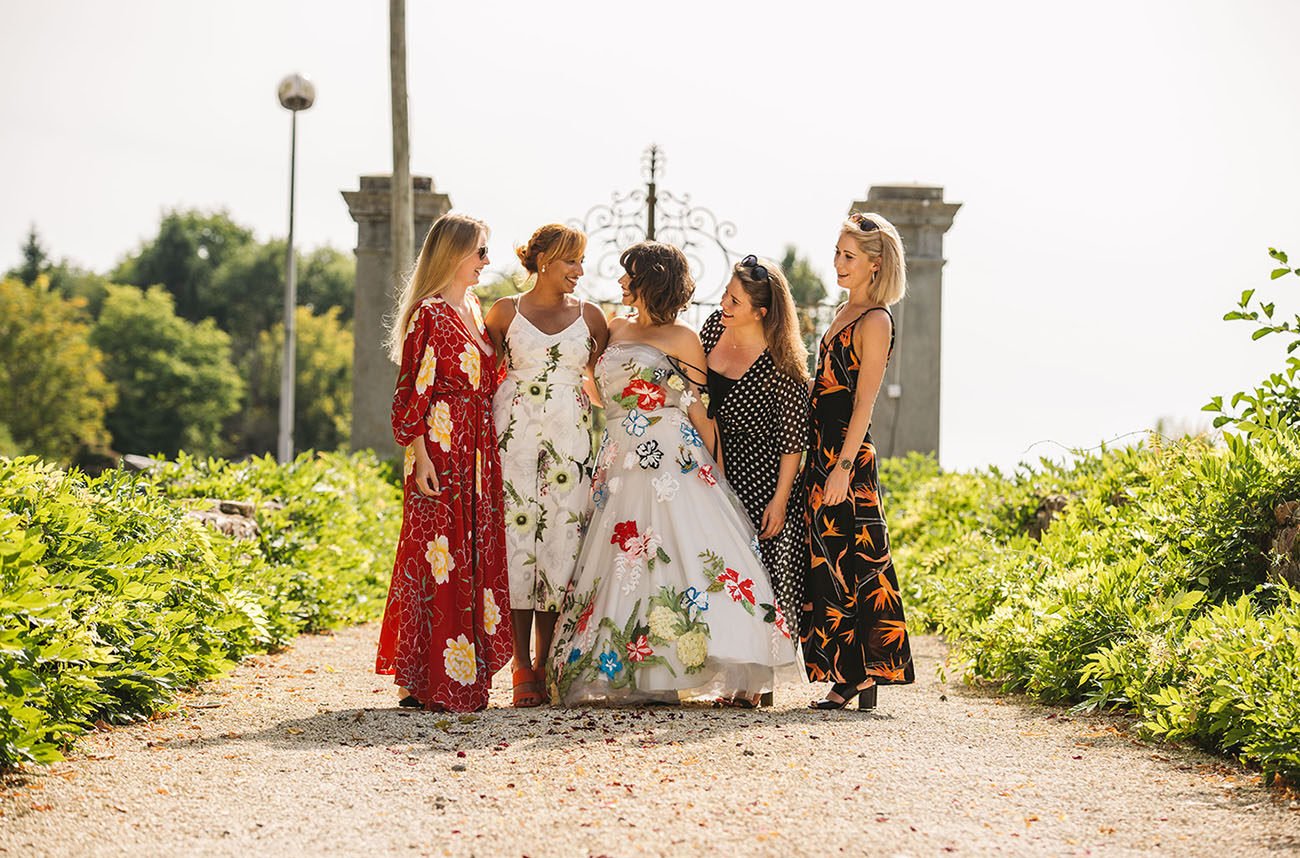 The bridesmaids were wearing various mismatching dresses of their taste