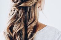 08 a twisted and braided half updo with messy beachy waves for a boho or free-spirited bride