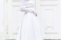 08 a white high low textural skirt with a train and a chunky off the shoulder sweater with long sleeves