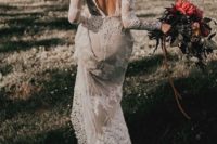 08 an amazing lace applique wedding gown with an A-line silhouette, long sleeves and an open back