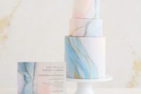 09 a romantic light blue and pink marbleized wedding cake with gold leaf and a matching card