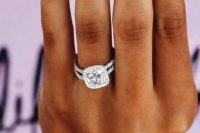 09 a white gold double band engagement ring with a large cushion diamond and a halo is timeless classics