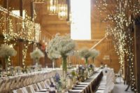 09 place some large branches or tree parts in your venue lights to make the space unique
