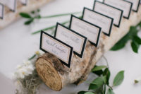 10 The wedding escort cards were done in black and white and placed on branches