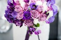 10 a lush wedding bouquet with violet, purple, pink and white blooms for a chic and bold look