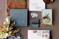 10 a wedding invitation suite with slate blue and brown leather touches is very bold and chic
