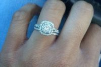 10 a white gold engagement ring with a cushion cut diamond and a halo