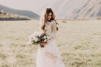 11 a chic wedding dress with an illusion bodice, long sleeves and a flowy skirt for eloping to the mountains