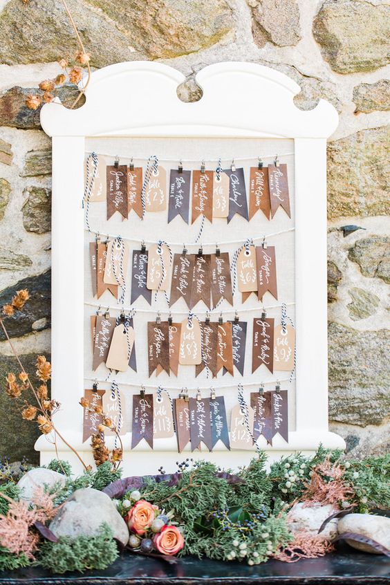 a leather tag seating chart is a cool idea for a rustic wedding