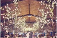 11 lit up trees are perfect for lining up the aisle, this is pure magic