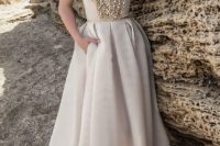 11 strapless sweetheart neckline wedding dress with an embellished bodice and skirt detailing
