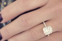 12 a gold engagement ring with a large square diamond is a stylish idea to try